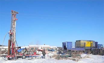 Drilling rig at the construction site on the Sino-Russian border at minus 32 deg